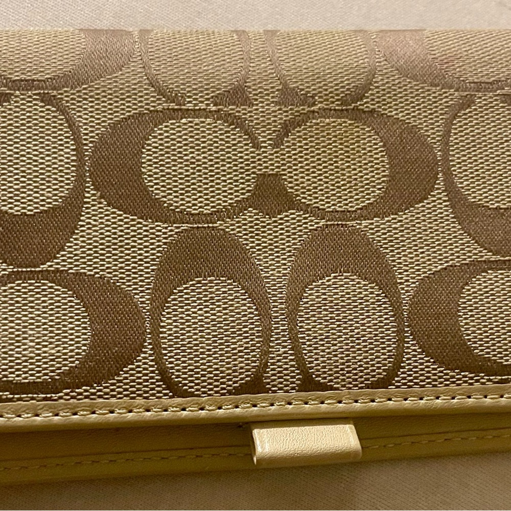 Sleek Coach tan and brown “Signature C” checkbook wallet